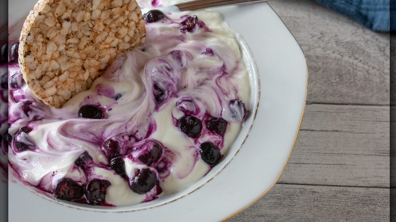 ice cream with flaked nuts and crushed chocolate