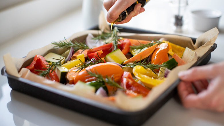 veggies in pan with parchment paper