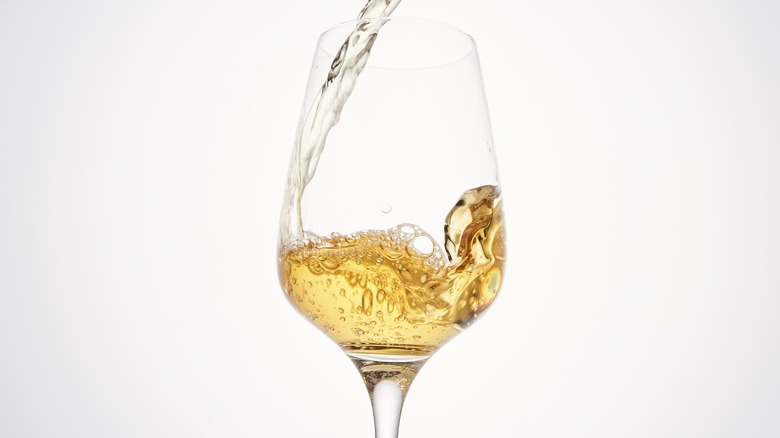 White wine poured into glass