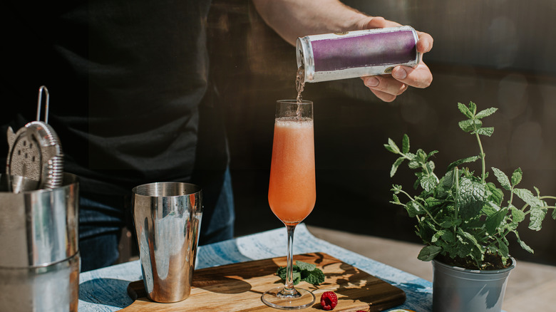 Bartender pouring canned wine