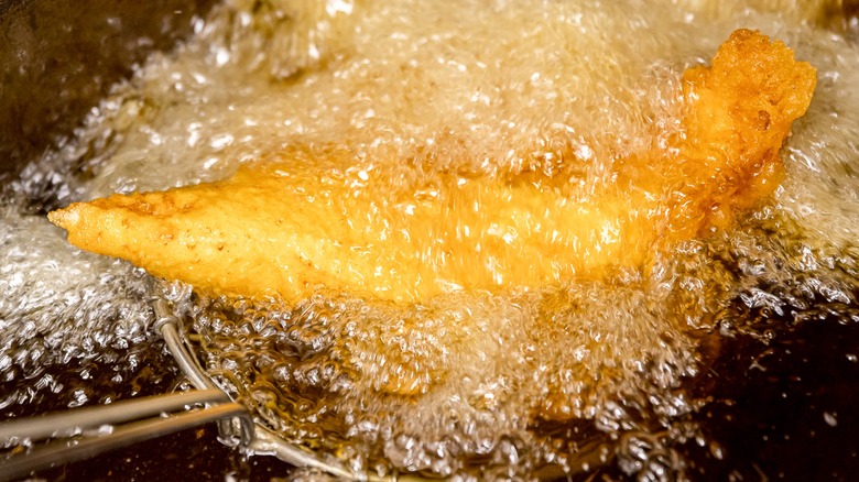 Fish frying in bubbling oil