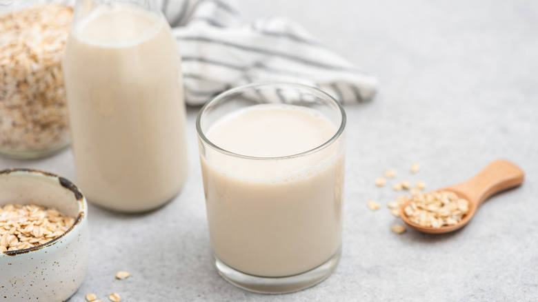 Jar of oat milk on top of oats