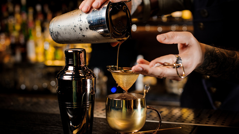 bartender pouring a drink