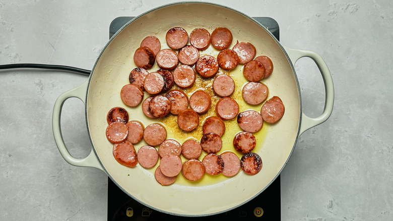 cooked, sliced andouille in skillet