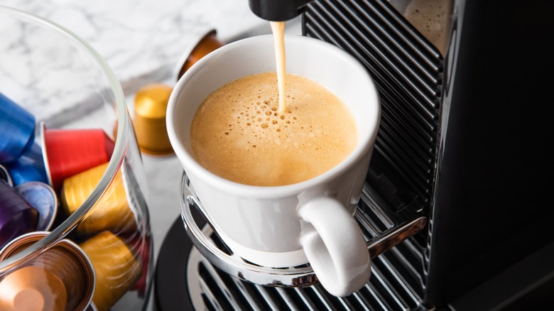 nespresso machine brewing coffee