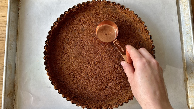 preparing ginger cookie tart crust