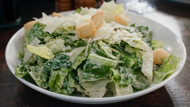 A plated Caesar salad on a table