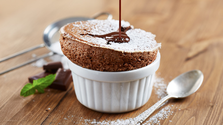 Chocolate souffle in a white ramekin