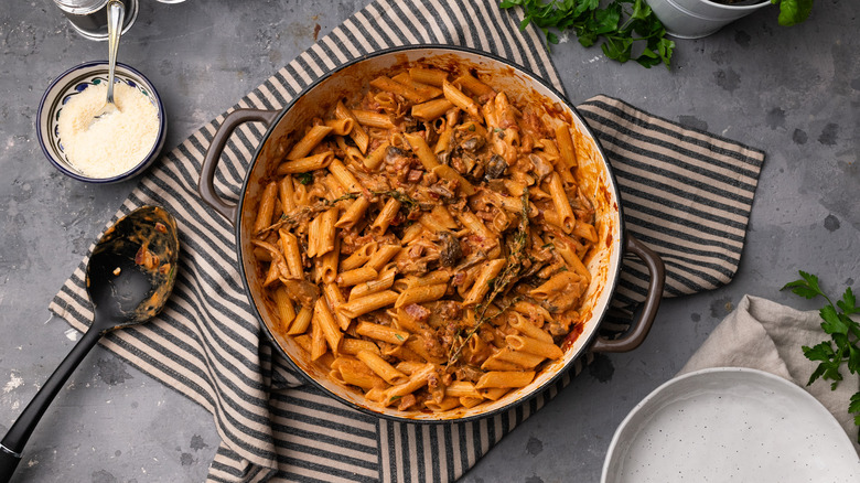 penne boscaiola being served 