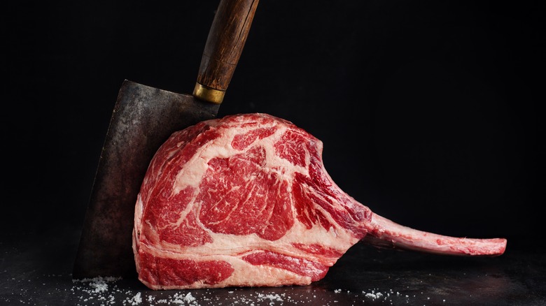 Tomahawk steak and meat cleaver 