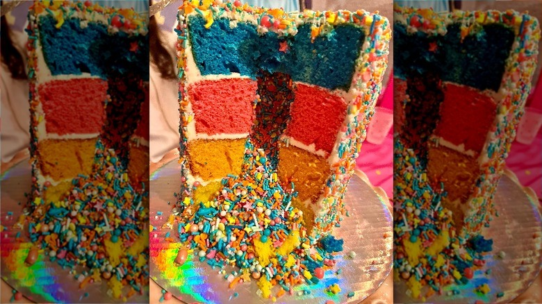 cake with sprinkles spilling out of the inside