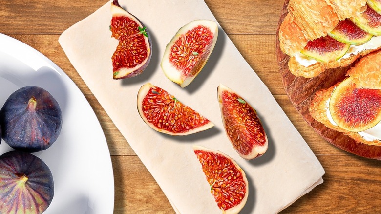 Top-down view of plated sliced figs and pastries
