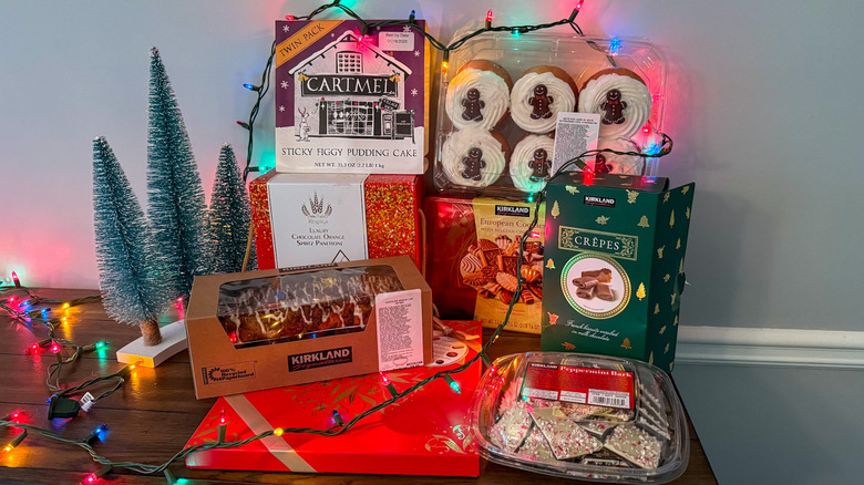 Costco holiday desserts stacked on a wooden table with decorations