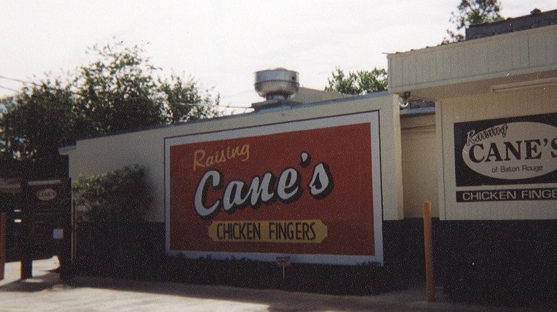 View of Raising Cane's original location with restaurant sign displayed.