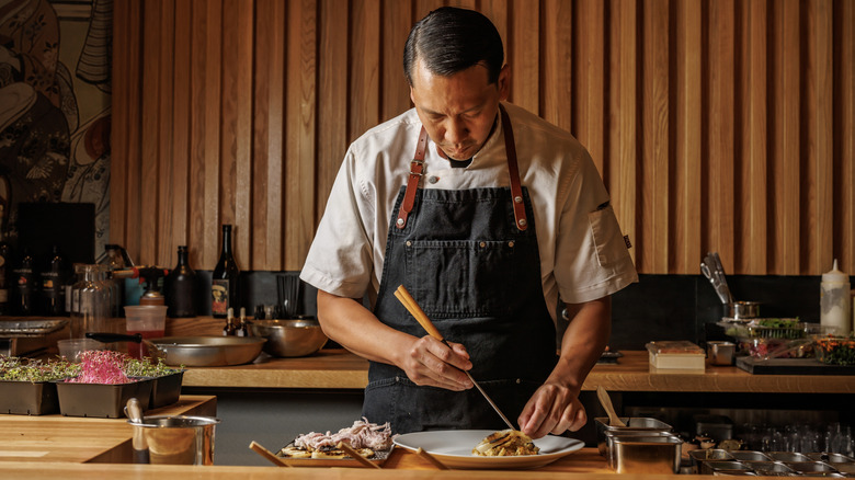 Chef Paul Sananikone crafting an omakase course