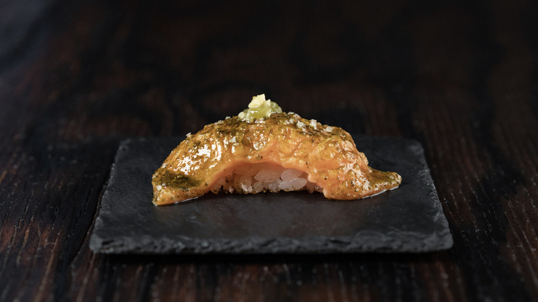 Salmon nigiri from Sushi by Scratch, topped with matcha and pickled wasabi