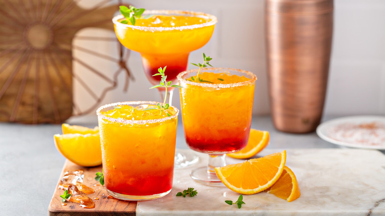 Tequila sunrise cocktails and oranges 