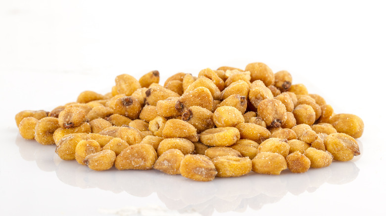 Corn nuts on a white surface
