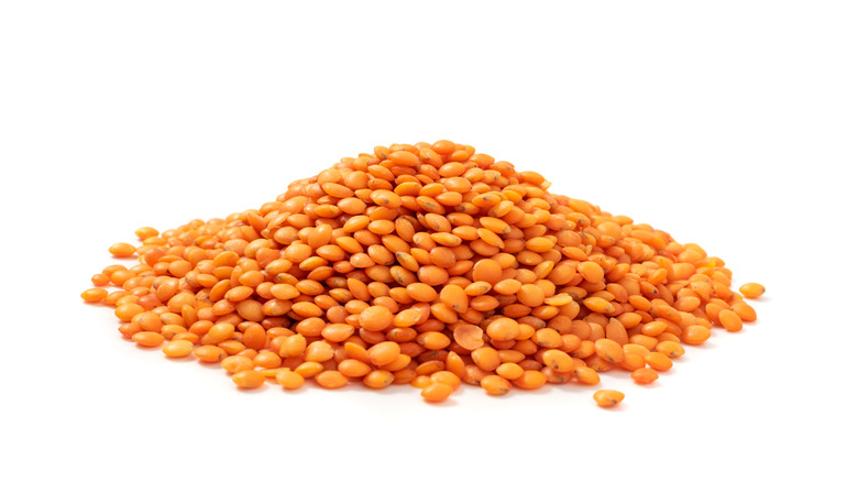 Pile of lentils on white background