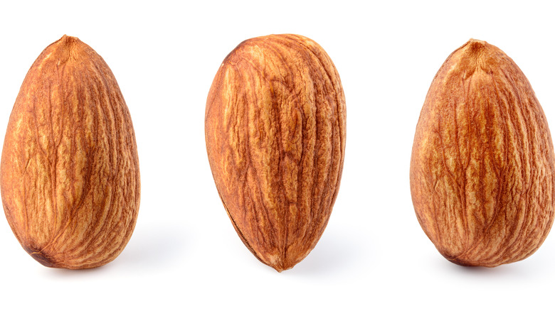 Almonds on white background