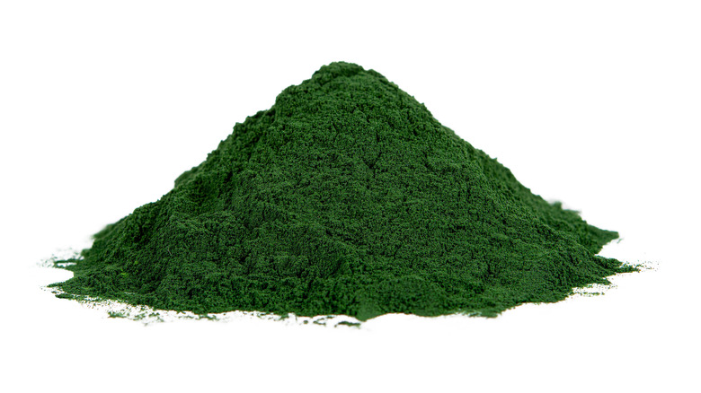 Spirulina powder on white background