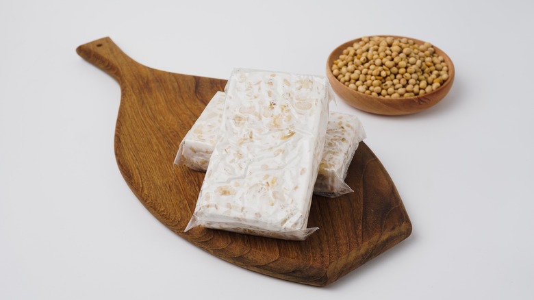 Raw tempeh on wooden board