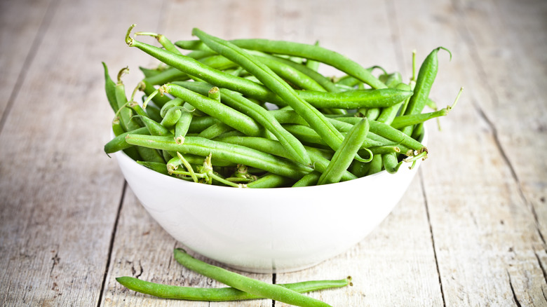 Fresh green beans in bowl 