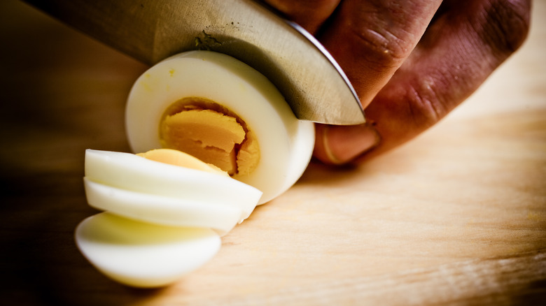 knife slicing egg