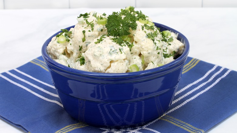 Garnished potato salad in bowl