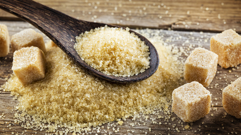 Spoonful of brown sugar and brown sugar cubes