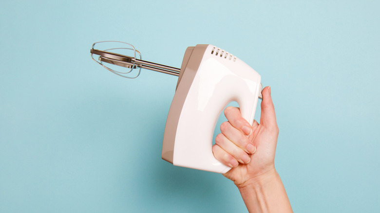 Hand holding mixer