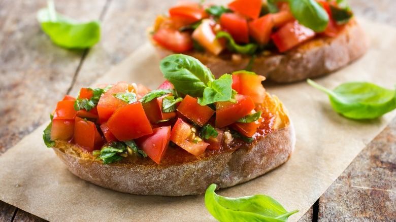 Prepared bruschetta with basil