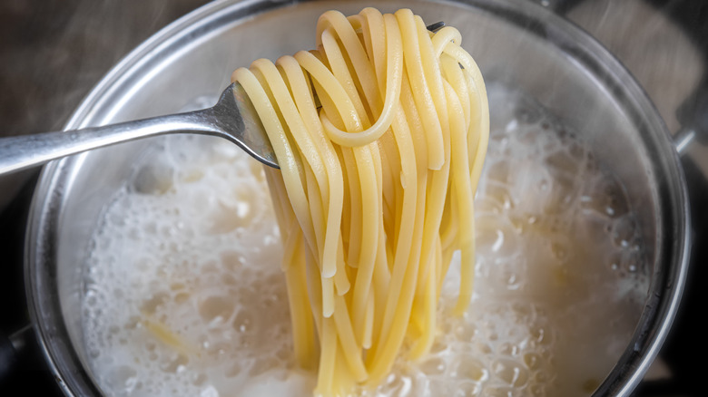 Spaghetti over boiling water