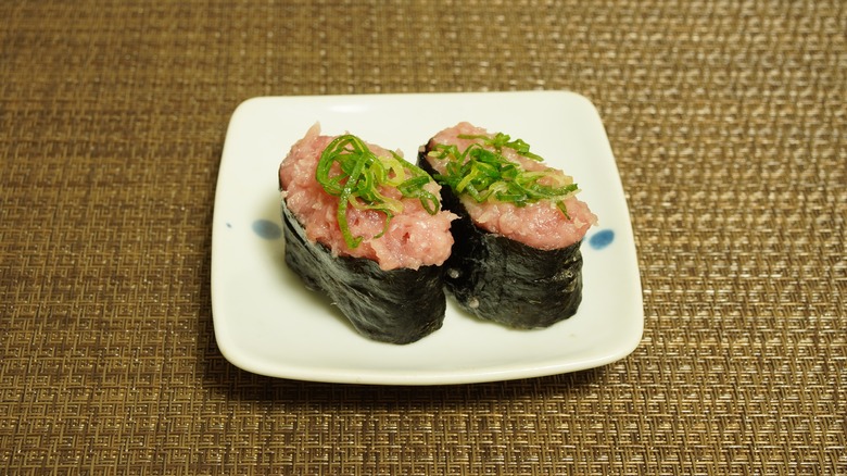 Negitoro sushi rolls on plate 