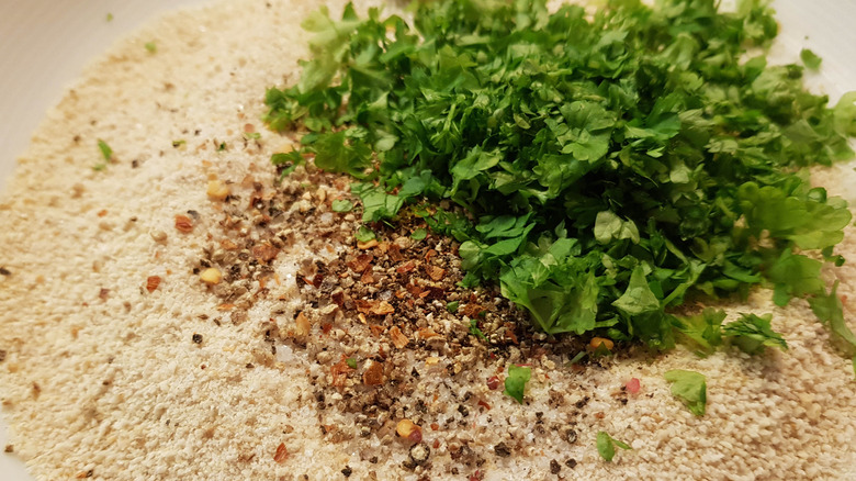 Breadcrumbs pile with herbs spices