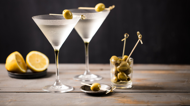 Two martinis with olives