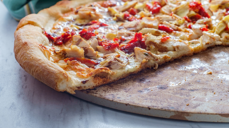 pizza on a baking stone