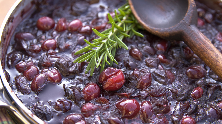 cranberry sauce with wooden spoon