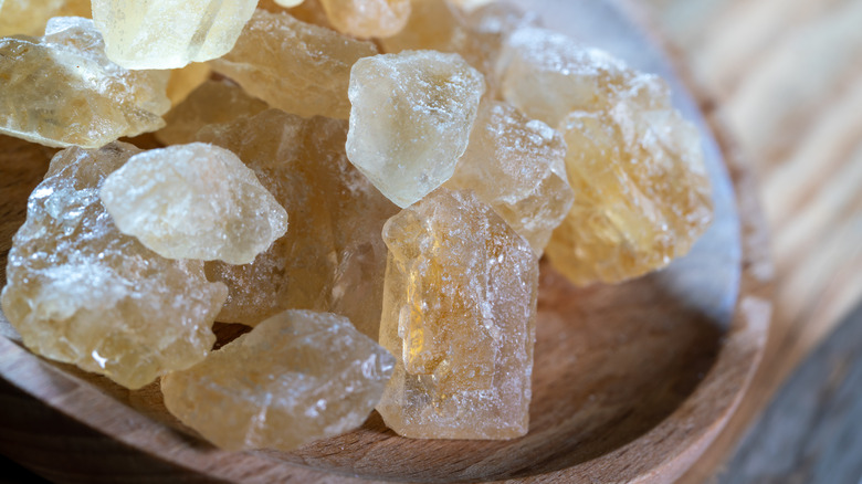 Close-up of yellow rock sugar in bowl