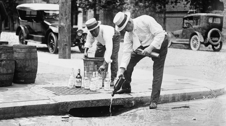 Alcohol being poured during Prohibition