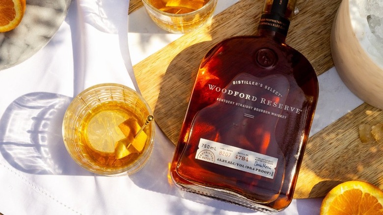 Woodford Reserve bottle with cocktail