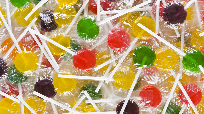 A pile of individually wrapped lollipops