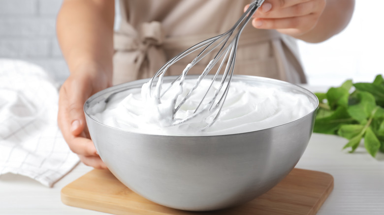 Hand whisking whipped cream