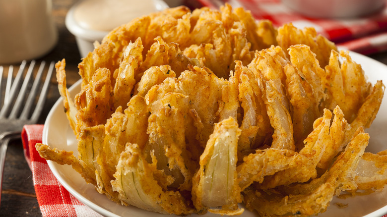 A deep-fried blooming onion on a plate