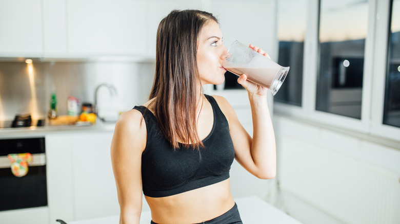 woman drinking smoothie