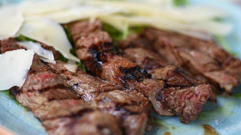 Sliced steak with parmesan