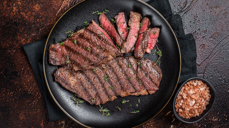 Steak in pan and salt