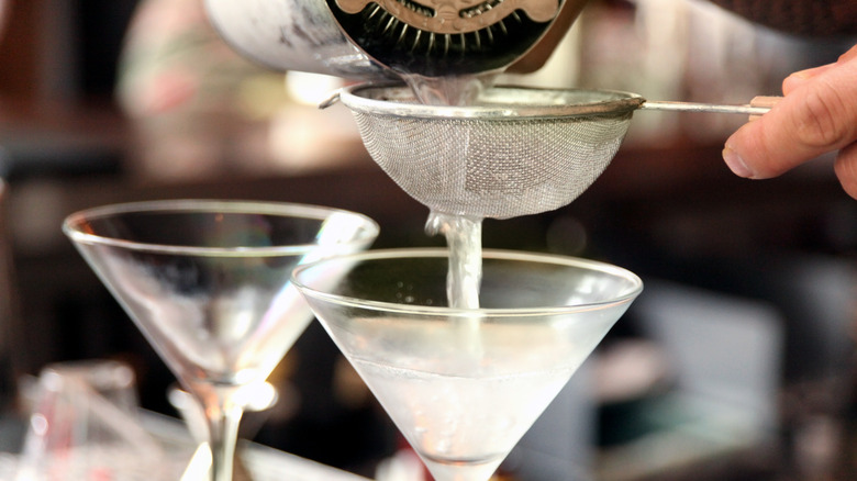 pouring prepared martinis