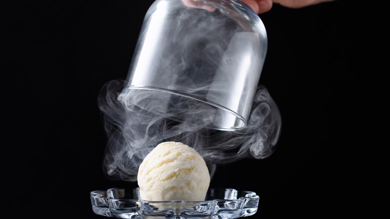 ice cream scoop in a smoking cloche