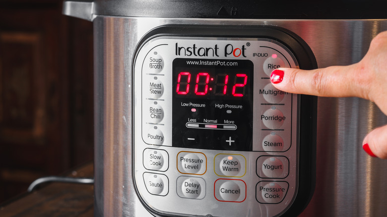 Pressing a button on an Instant Pot